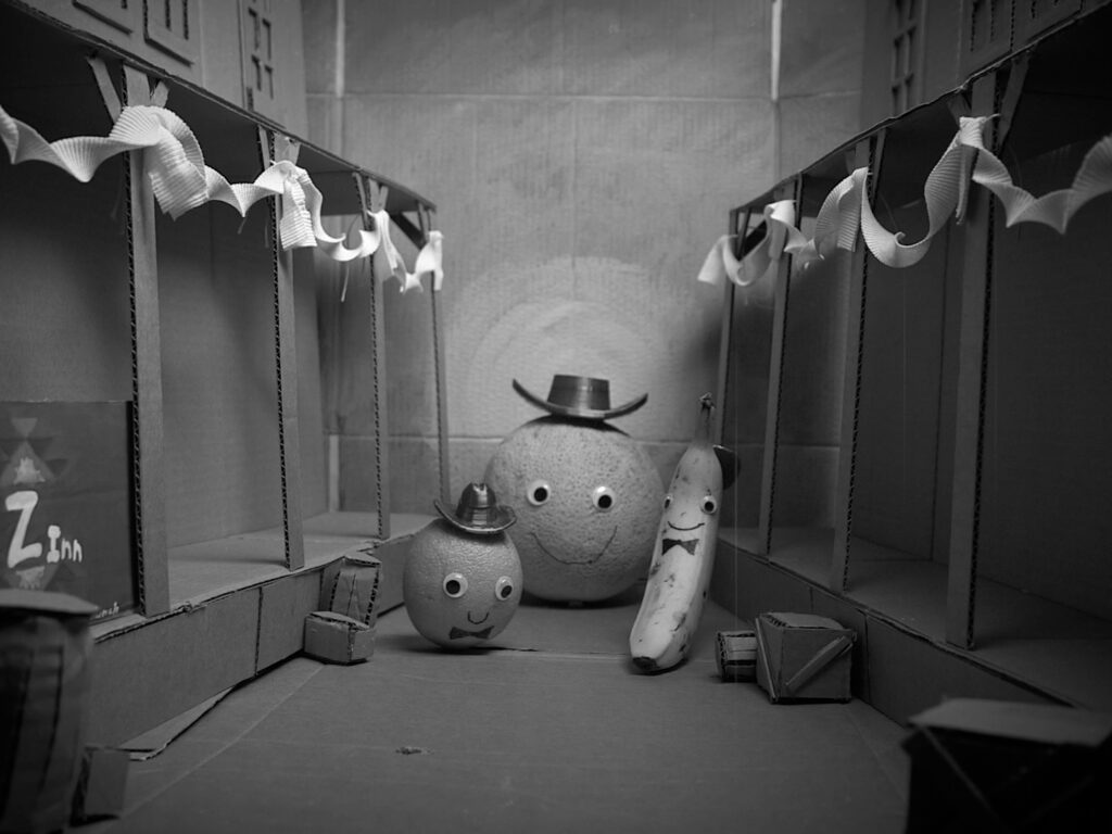 Cantaloupe Dan marries Banana Cassidy and the Sunkist Kid on a festive Main Street.