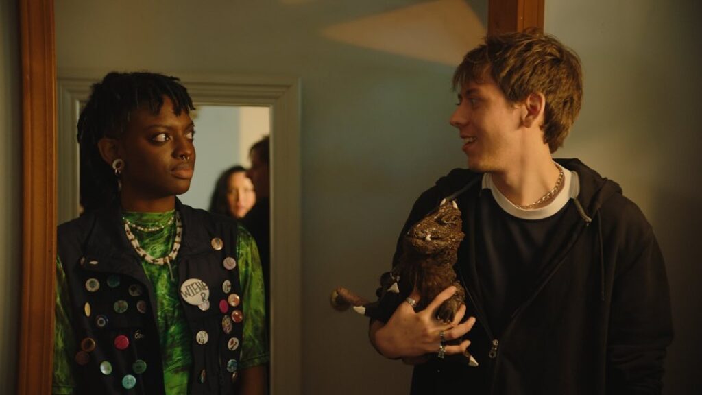 Worm Breath and Constance (played by Aiden Williamson) chat in the doorway of John and Charlotte's house.