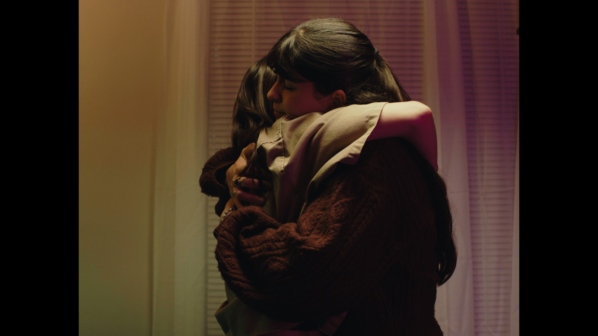 Mia and Valerie embrace.