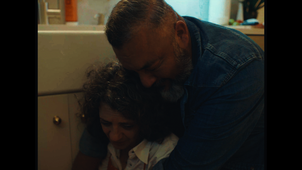 Carlos (played by Carlos Correa, Jr.) holds Julia in an emotional scene from In These Moments.