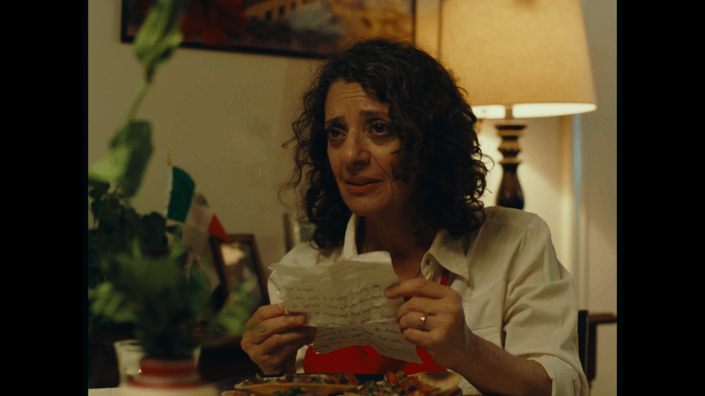 Julia, played by Diana Simonzadeh, holds a crumpled diary entry.