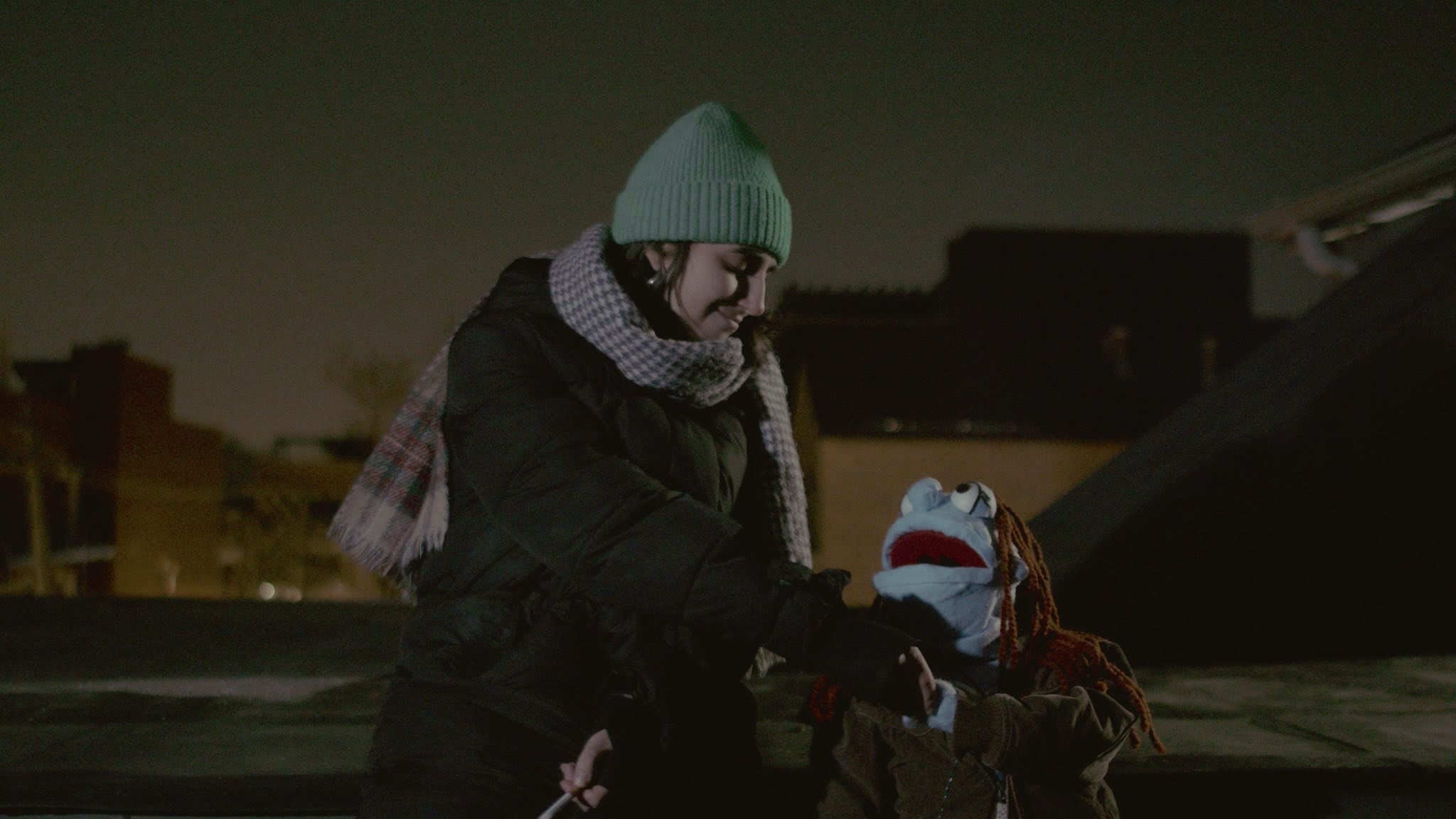 Phoebe and Graham share a cigarette on the roof.
