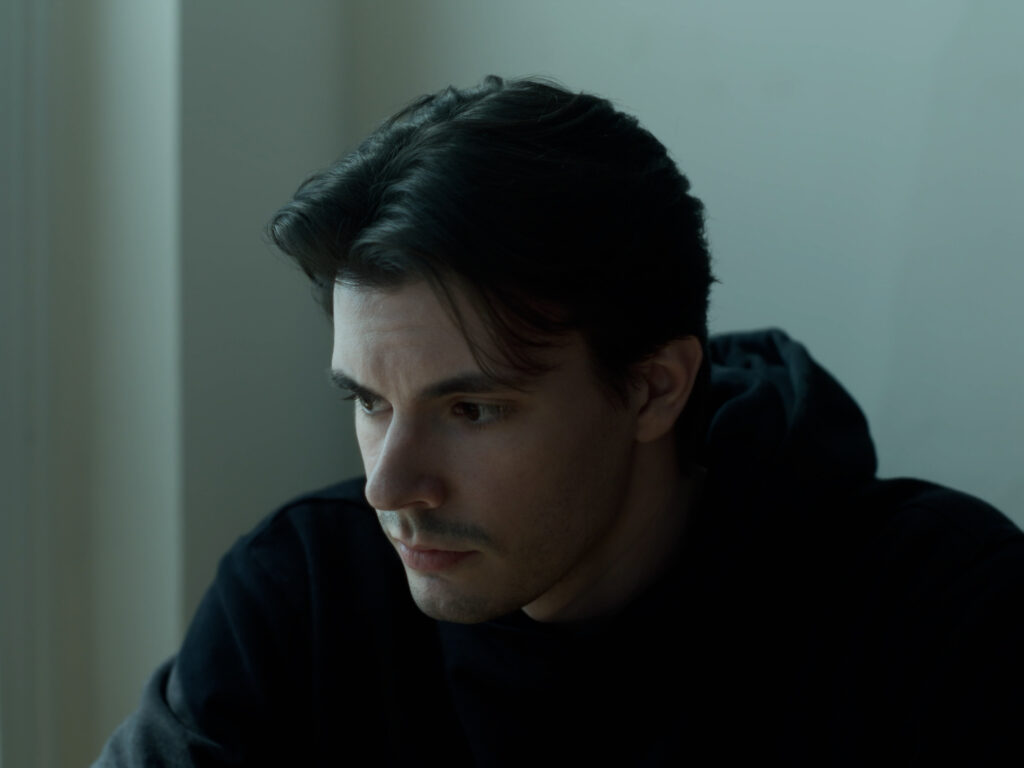 Thatcher, played by Dakota McCullom, averts his eyes.