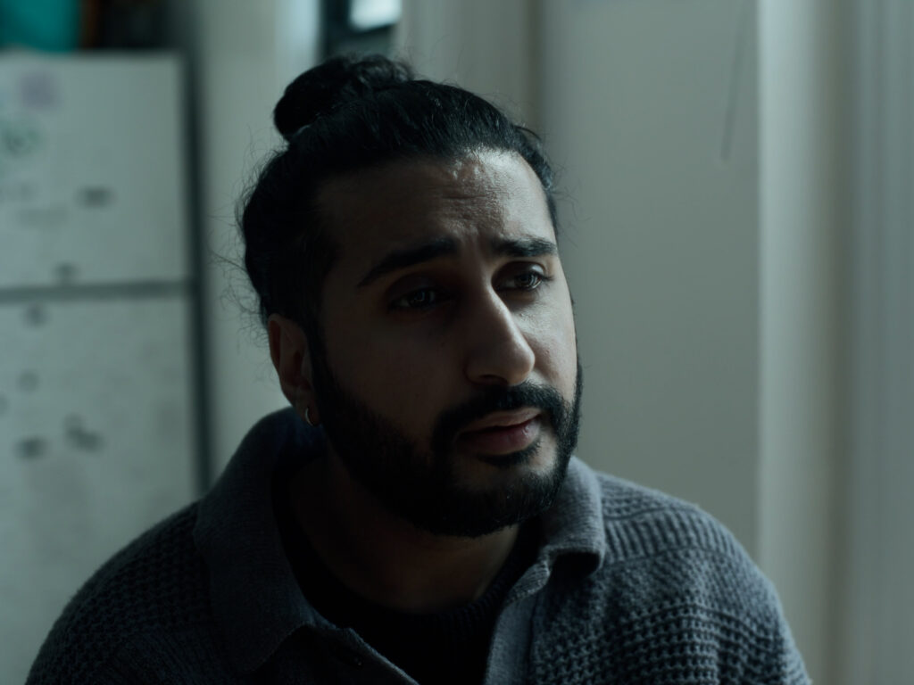 David, played by Harsh Gagoomal, looks hurt.